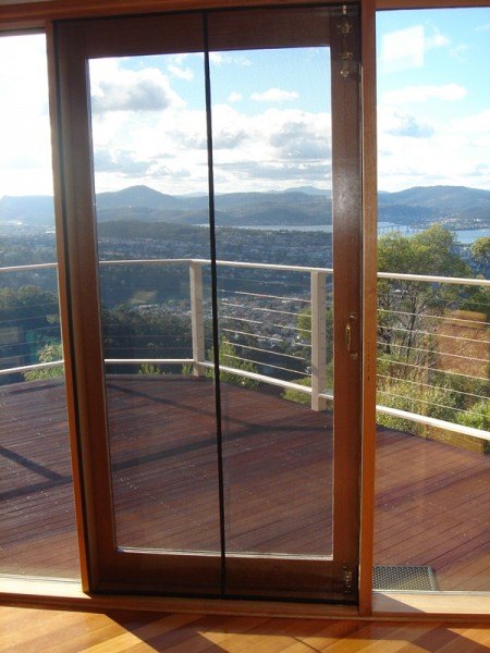 Magnetic fly screen shop door